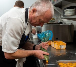 Reducing Food Waste: Chris making food in the kitchen